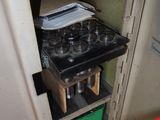 a stove that has a bunch of wine glasses on top of it