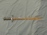 a knife that is laying on top of a sheet