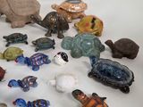 a lot of small figurines that are sitting on a table