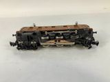 the toy train is sitting on the table on the white surface