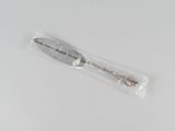a small knife in a plastic bag on a white surface