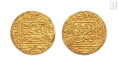 two gold coins, one of which has a picture of a man and a woman on it