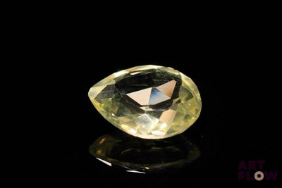 an image of a yellow diamond on a black surface