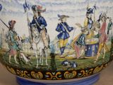 a blue and white vase with a painting on it