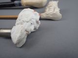 a small figurine of a man holding a baseball bat next to other items