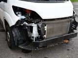 a white van that has a radiator on the front of it