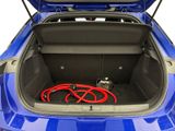 the trunk of a blue car with a hose in the trunk