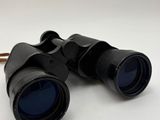 an image of a pair of binoculars sitting on top of a table
