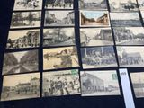 a lot of old black and white photos on the table