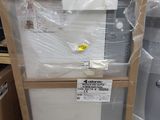a white toilet sitting in the middle of a pile of boxes