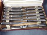 a lot of knives in a case on the table