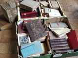 a box full of old books on the floor