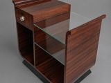 a wooden and glass side table with a glass shelf on top
