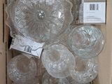 a box full of glass plates and bowls in it