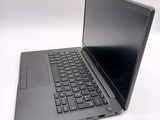 a laptop with a black keyboard on a white surface