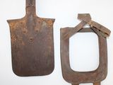 two old tools that are sitting on a white surface