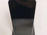 an image of a close up of a cell phone on a stand