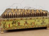 a small wooden box with a bunch of candles inside of it