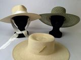 two hats are sitting on top of each other on a table
