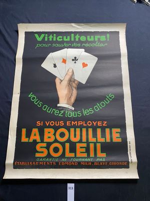 a poster of a hand holding playing cards on a table