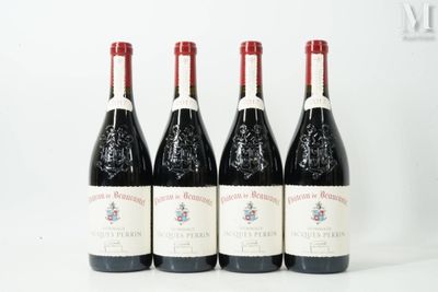 four bottles of wine are lined up on a white surface