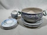 a bowl of soup and plates on a table
