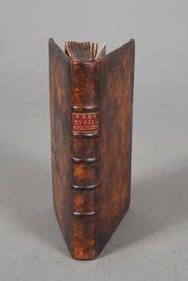 an old book that is sitting on a table