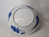 a blue and white bowl with blue flowers on it