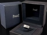 a black box with a ring inside of it on a table