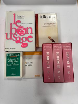 a box of books on a table with other books on it