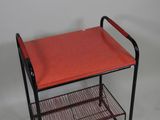 an image of a metal cart with a red seat