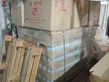 many boxes stacked on top of each other in a warehouse