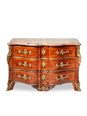 an antique chest of drawers with marble top