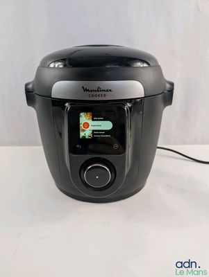 an image of a black electric pressure cooker on a white table