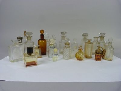 a lot of glass bottles sitting on a table