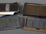 four different types of cards in a box on a table