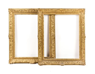 a pair of antique gold picture frames on a white background
