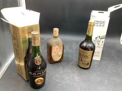 three bottles of alcohol sitting next to each other on a counter