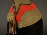 an image of a hat with a tassel on top of it