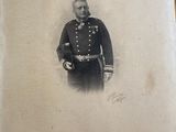 an old photo of a man in a military uniform