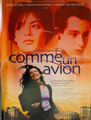 the poster for the movie comme un avion is hanging on the wall