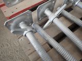 a close up of a bunch of metal pipes on a pallet