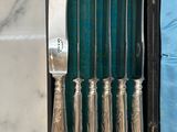 a box with a set of silverware inside of it