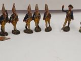 many figurines of soldiers on display on a table