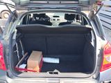 the back of a car with its trunk open and a box in the trunk