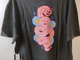 a t - shirt with a pink snake on the back of it