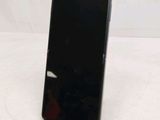 an image of a cell phone sitting on top of a table
