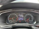 an image of a car dashboard with various gauges