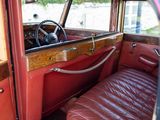 a red car with a leather seat and a steering wheel