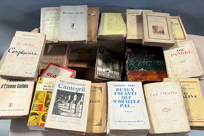 many books stacked on top of each other on a table